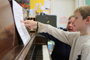 student at piano lesson